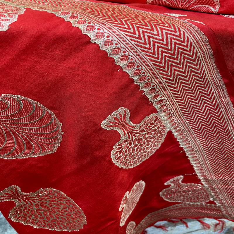 Elevate your style with a regal deep red Banarasi handloom kadhwa silk scarf. Handcrafted with intricate kadhwa work for a touch of opulence.