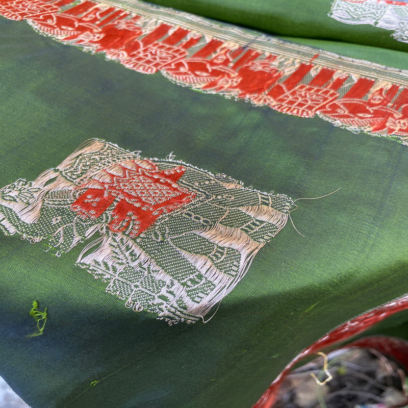 Elevate your style with a majestic mehendi green Banarasi handloom kadhwa silk scarf. Handcrafted with intricate kadhwa work.