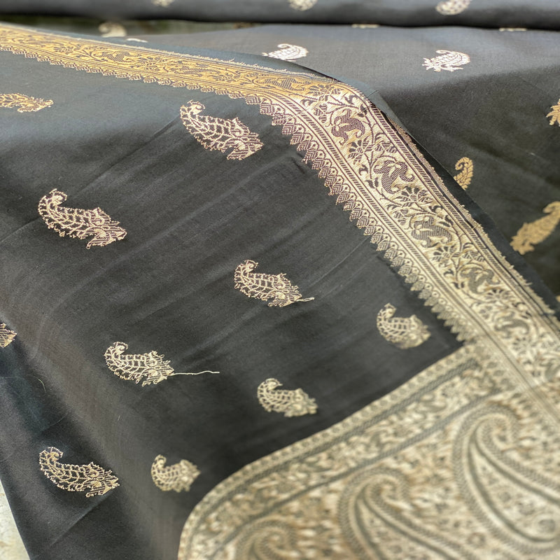 Timeless elegance in a black Banarasi handloom kadhwa silk scarf, exuding sophistication and style for a touch of luxury.