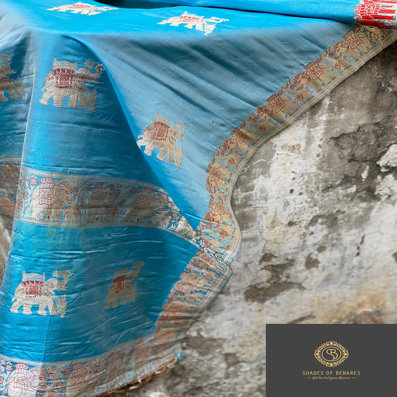 Sky blue Minakari Banarasi handloom kadhwa silk scarf with intricate Minakari work. Elevate your style with timeless beauty and sophistication. Shop now for opulence and charm!