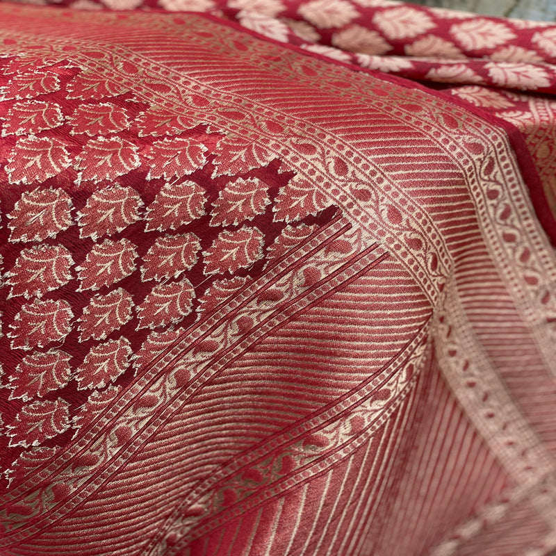 Elevate your look with a regal maroon Banarasi silk brocade handloom scarf. Handcrafted with intricate brocade work for a touch of opulence.
