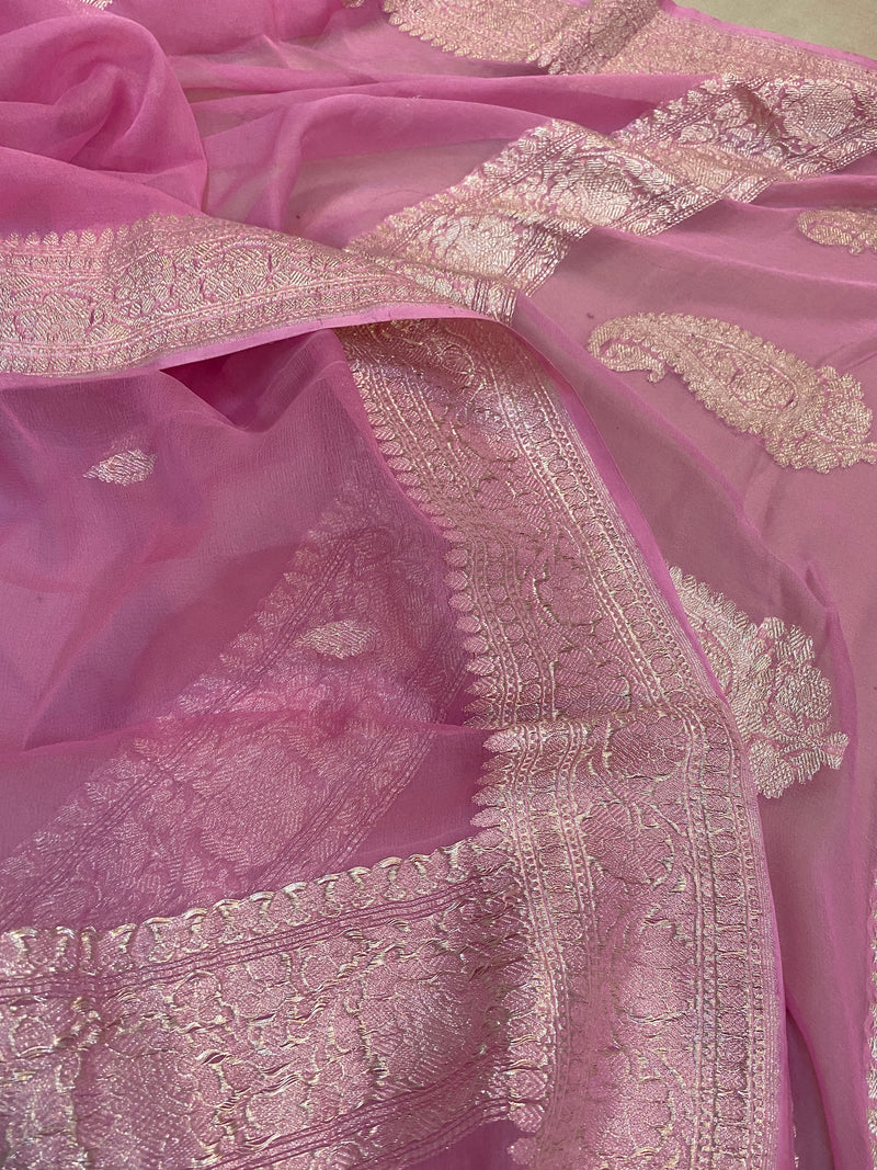This elegant saree by Shades of Benares in baby pink pure Khaddi chiffon exudes graceful charm.