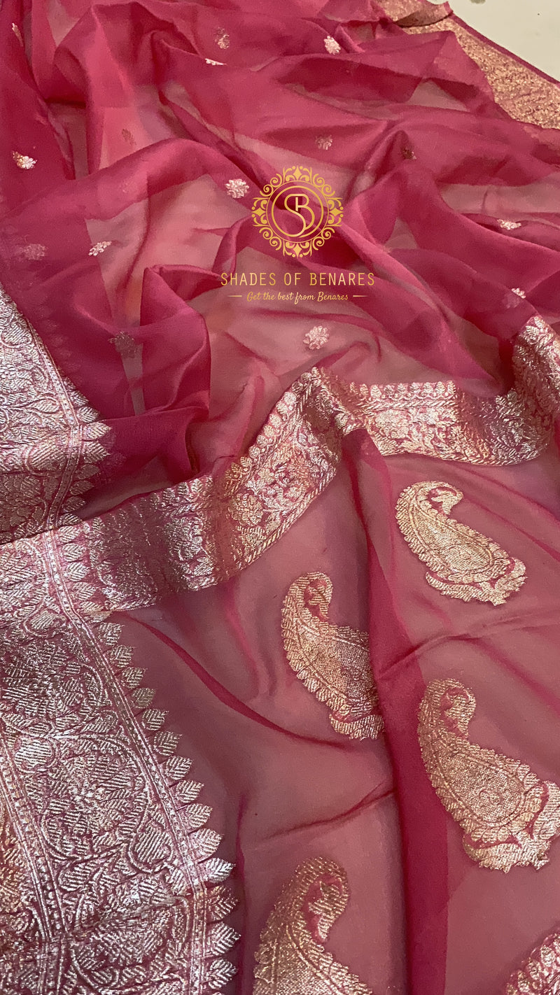 A stunning Strawberry Pink Pure Khaddi Chiffon Banarasi Saree by Shades of Benares, radiating beauty and elegance.