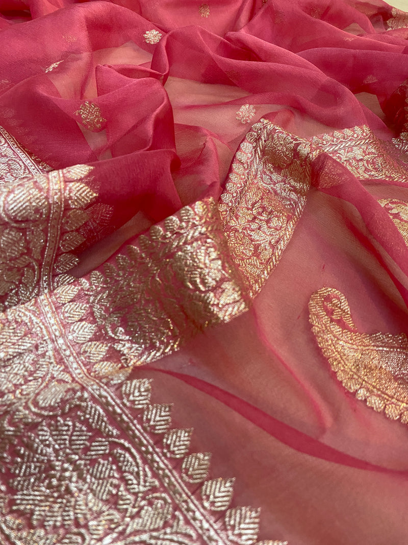Radiant Beauty: Strawberry Pink Pure Khaddi Chiffon Banarasi Saree by Shades of Benares, a true symbol of elegance.