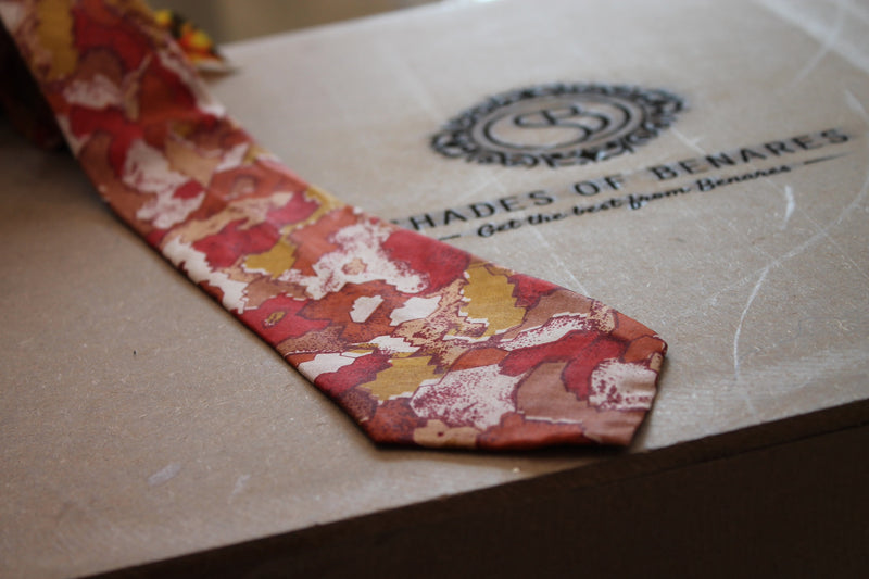 Stunning white and red men's neck tie in pure Banarasi silk with hand print. Perfect accessory for a sophisticated look.