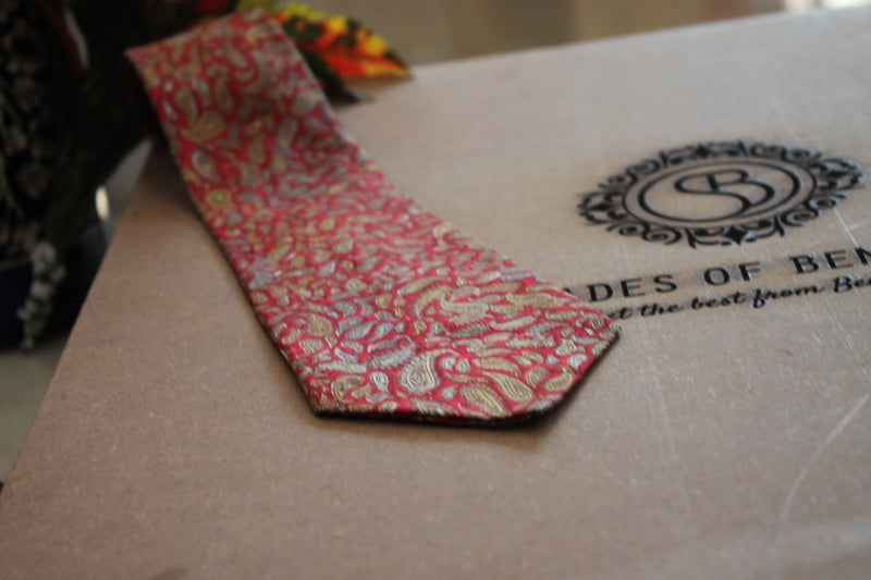 Red Banarasi silk men's neck tie by Shades of Benares, a classic accessory for formal occasions.