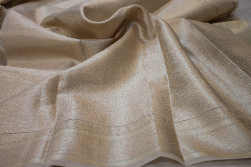 Exquisite Creme Pure Tissue Silk Handloom Banarasi Sari: a stunning creation by shades of benares.