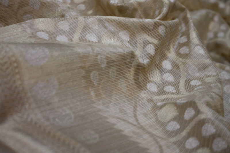 Limited edition pure tissue silk Banarasi sari in elegant cream shade by Shades of Benares, a must-have masterpiece.