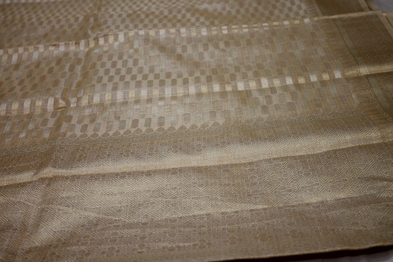 Timeless elegance in Beige Pure Tissue Silk Sari by shades of Benares: A timeless classic.