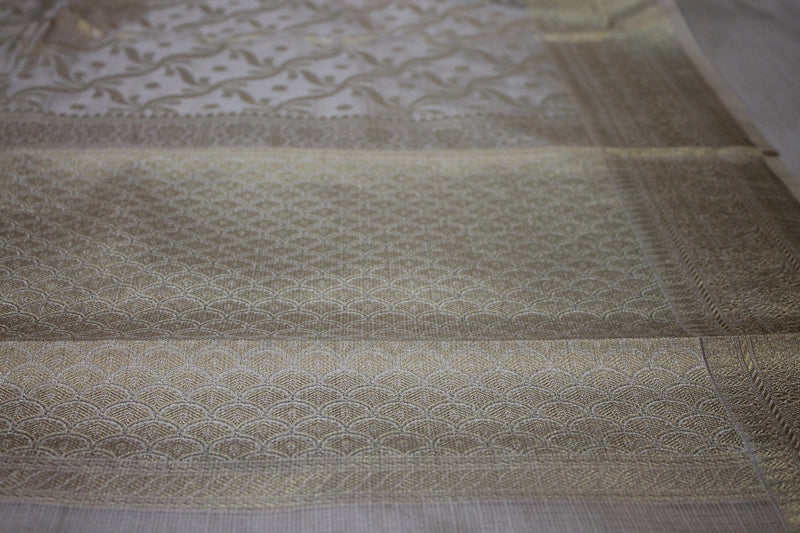 Timeless Elegance: Off-White Pure Tissue Silk Sari by Shades of Benares, a symbol of traditional grace.