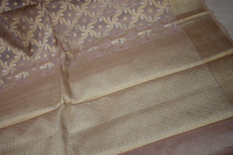 Elegant baby pink sari made of pure tissue silk from Shades of Benares.
