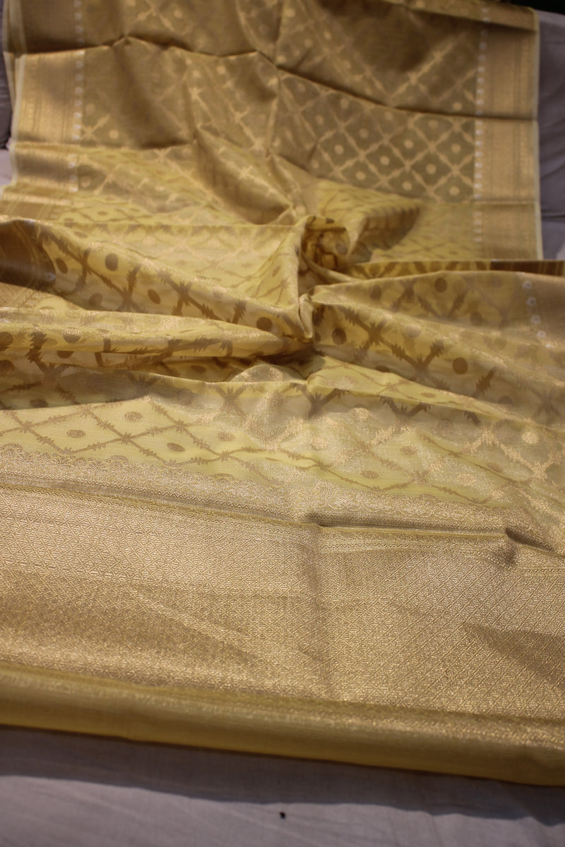 Shades of Benares' elegant yellow tissue silk saree, radiating charm.