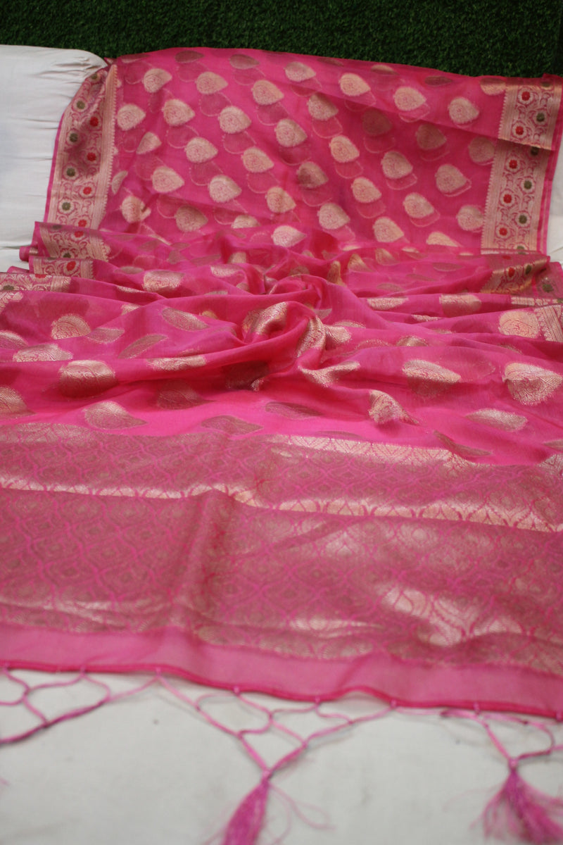 Shades of Benares presents an exquisite Pink Kora Organza Handloom Banarasi Saree - a beautiful traditional Indian garment.