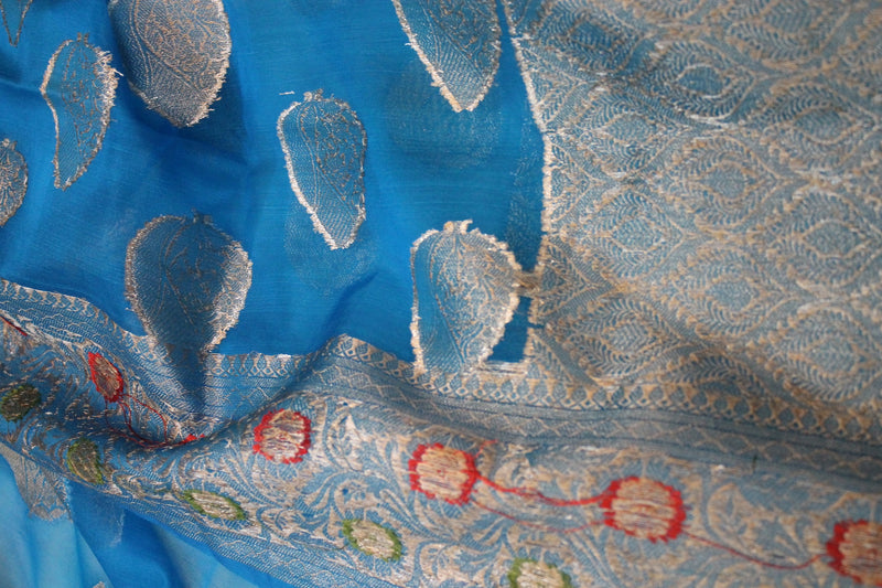 Fine blue Kora Organza handloom Banarasi saree from Shades of Benares. Limited edition piece with exquisite craftsmanship.