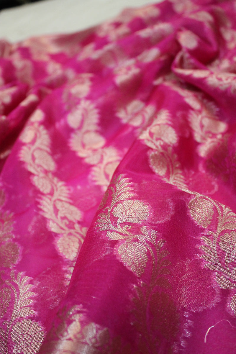 Ravishing Rani Pink Kora Organza Handloom Banarasi Saree by shades of benares - a stunning pink saree with intricate handloom work.
