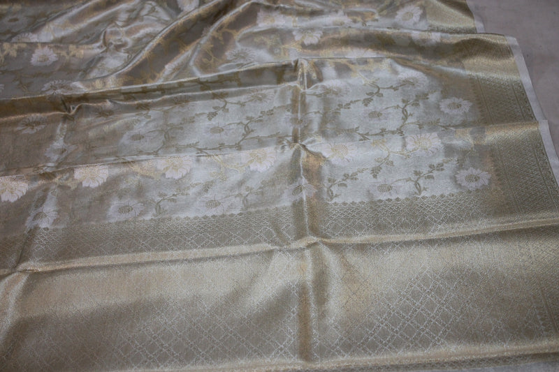Elegant white pure tissue silk saree by shades of benares, showcasing purity in limited edition.