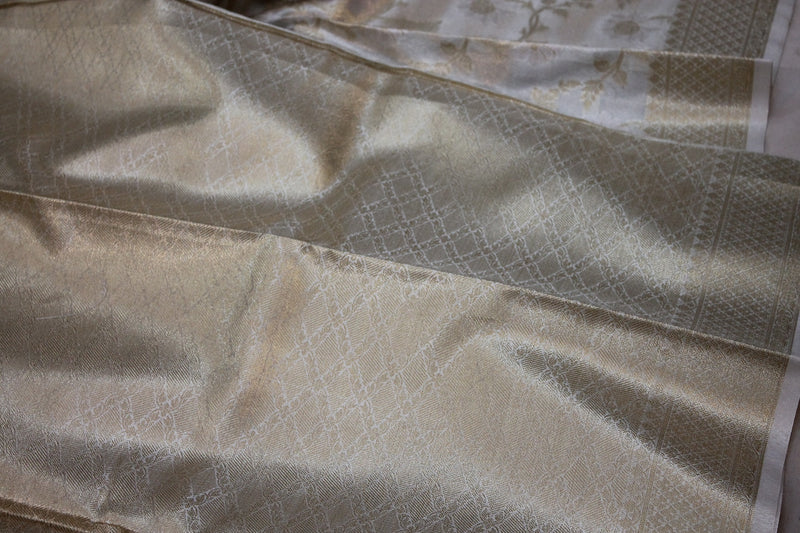 Explore the Limited Edition White Pure Tissue Silk Saree by shades of benares, a symbol of elegance.