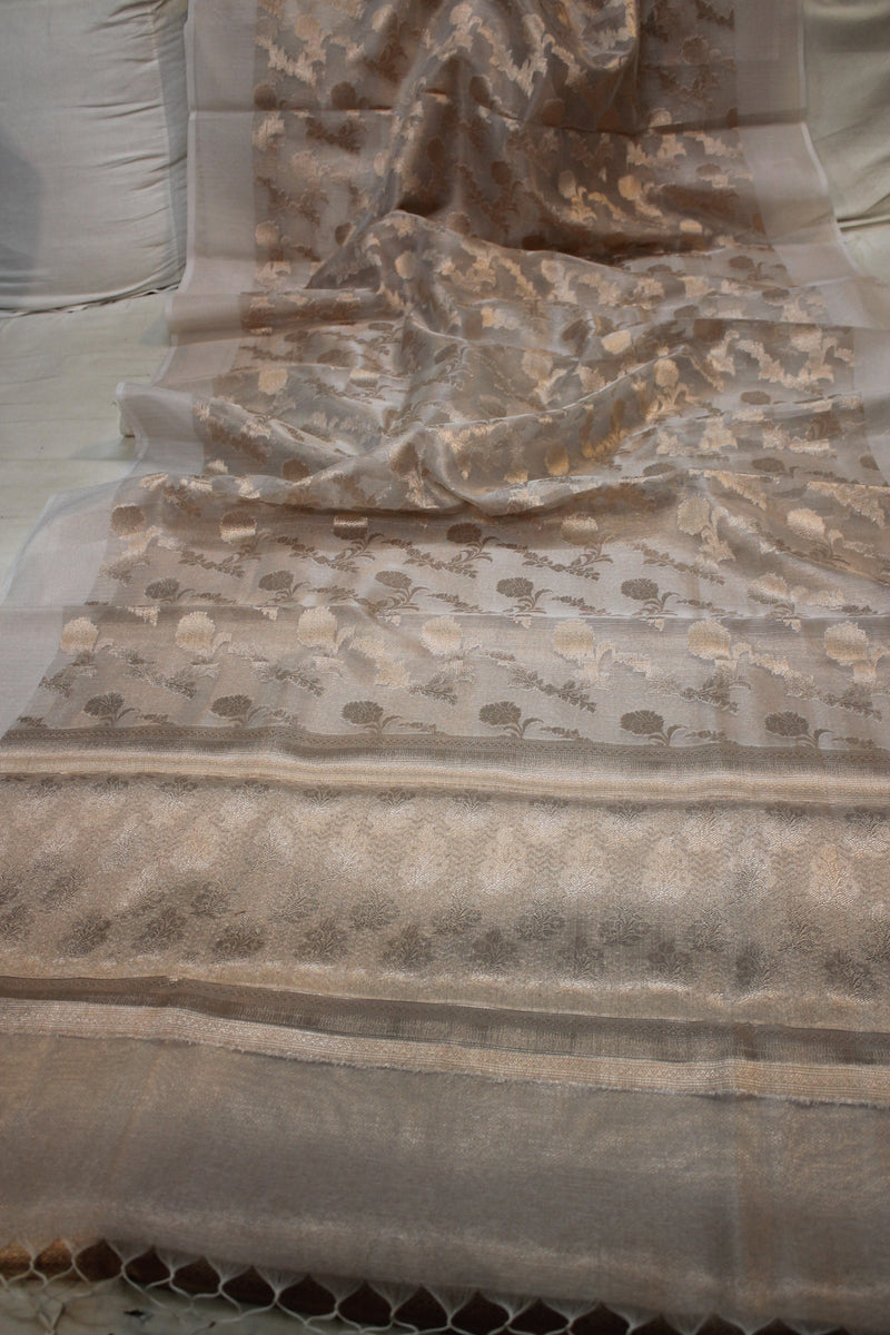 Off-white pure tissue silk Banarasi saree with artisanal gold jaal design by Shades of Benares.