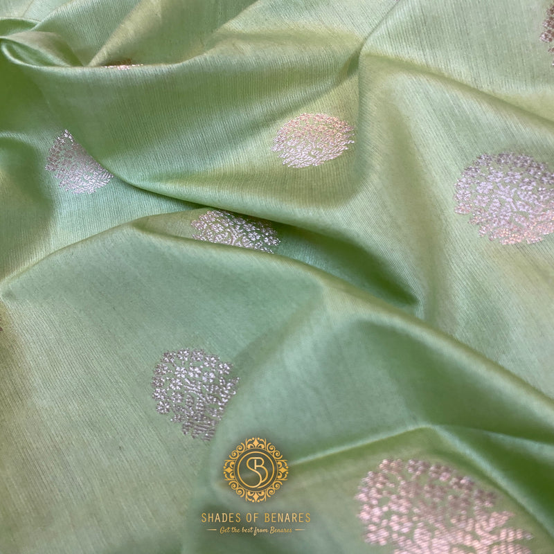 Pastel green handloom crepe Banarasi silk sari with delicate motifs, exuding sophistication and cultural richness.