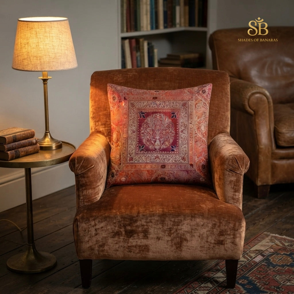 Multicolor brocade Banarasi cushion cover with flowering tree in urn on a velvet armchair