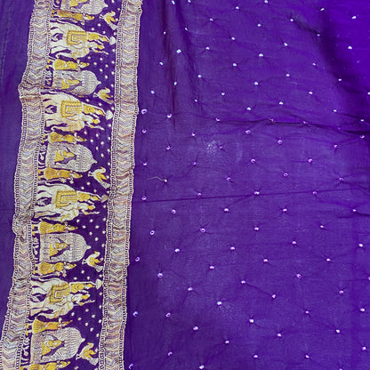 The Royal Amethyst: Purple Khaddi Georgette Bandhani Saree with Minakari Shikargaah Where two worlds of artistry collide, a masterpiece is born. by Shades Of Banaras - banarasi - banarasi saree shop - banarasi saree manufacturers - banarasi saree wholesale - banaraasi sarees