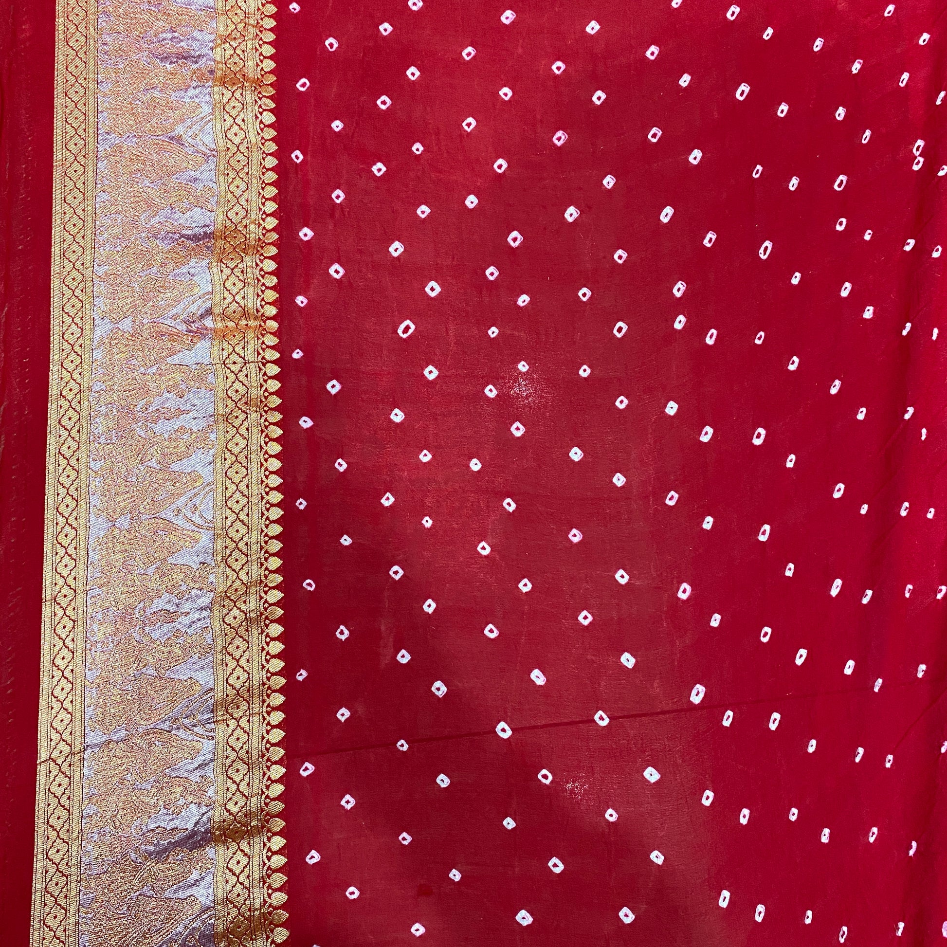 Crimson Heritage: Red Khaddi Georgette Bandhani Saree with Shikargaah Weave The quintessential hue of love, reimagined in the lightest of silks. by Shades Of Banaras - banarasi - banarasi saree shop - banarasi saree manufacturers - banarasi saree wholesale - banaraasi sarees