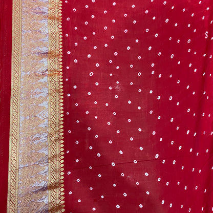 Crimson Heritage: Red Khaddi Georgette Bandhani Saree with Shikargaah Weave The quintessential hue of love, reimagined in the lightest of silks. by Shades Of Banaras - banarasi - banarasi saree shop - banarasi saree manufacturers - banarasi saree wholesale - banaraasi sarees