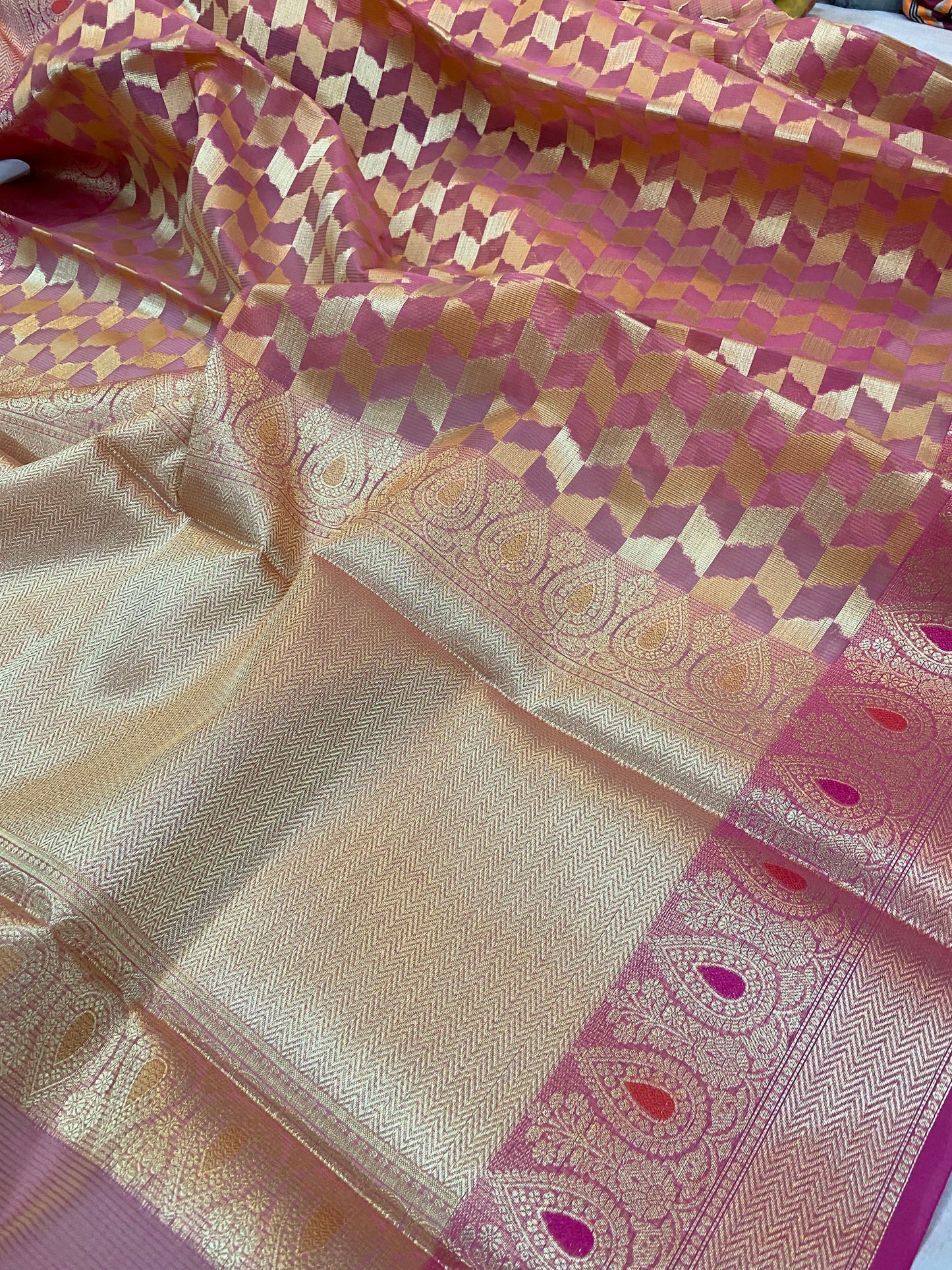 Blush Elegance: Pink Pure Kora Handloom Banarasi Saree by shades of benaras. A graceful pink saree with intricate handloom work.