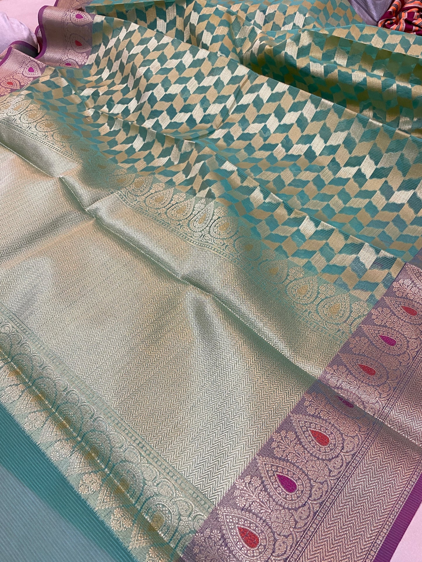 Sea Green Pure Kora Handloom Banarasi Saree by shades of benaras: A stunning sea green saree with intricate handloom work.