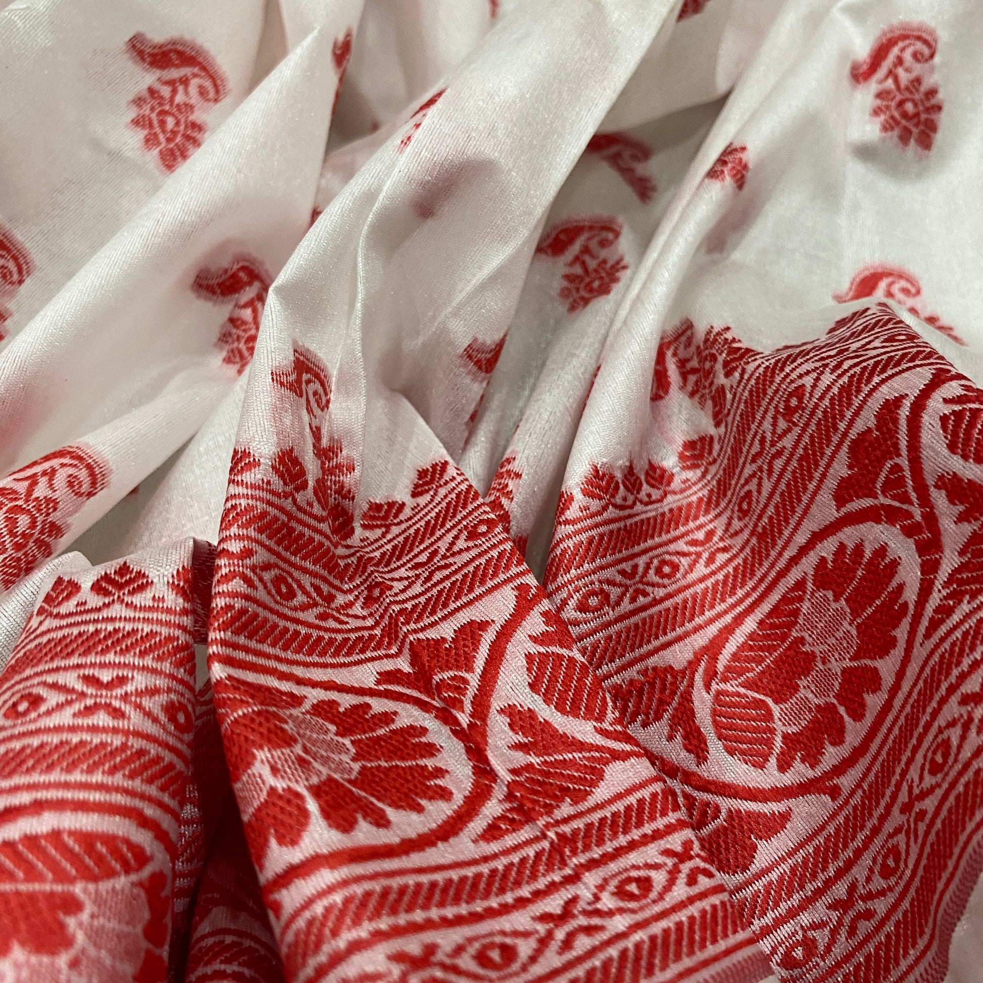 The Imperial Crimson Leaf: Luxe Hand-Embroidered White & Red Pure Cotton Banarasi Sari by Shades Of Banaras - banarasi - banarasi saree shop - banarasi saree manufacturers - banarasi saree wholesale - banaraasi sarees - banarasi sari - banarasi saris - silk saree - silk sari - wedding saree - wedding sari - designer sari - wedding collection - gifting