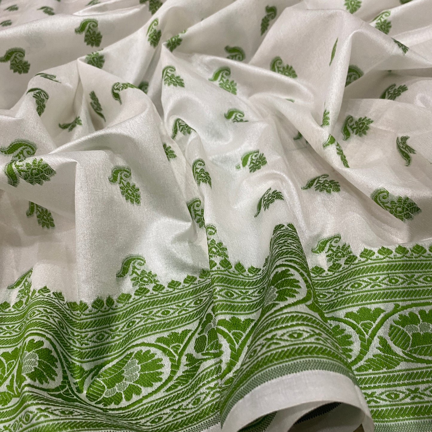 The Verdant Heirloom: Luxe Hand-Embroidered White & Green Pure Cotton Banarasi Sari by Shades Of Banaras - banarasi - banarasi saree shop - banarasi saree manufacturers - banarasi saree wholesale - banaraasi sarees - banarasi sari - banarasi saris - silk saree - silk sari - wedding saree - wedding sari - designer sari - wedding collection - gifting