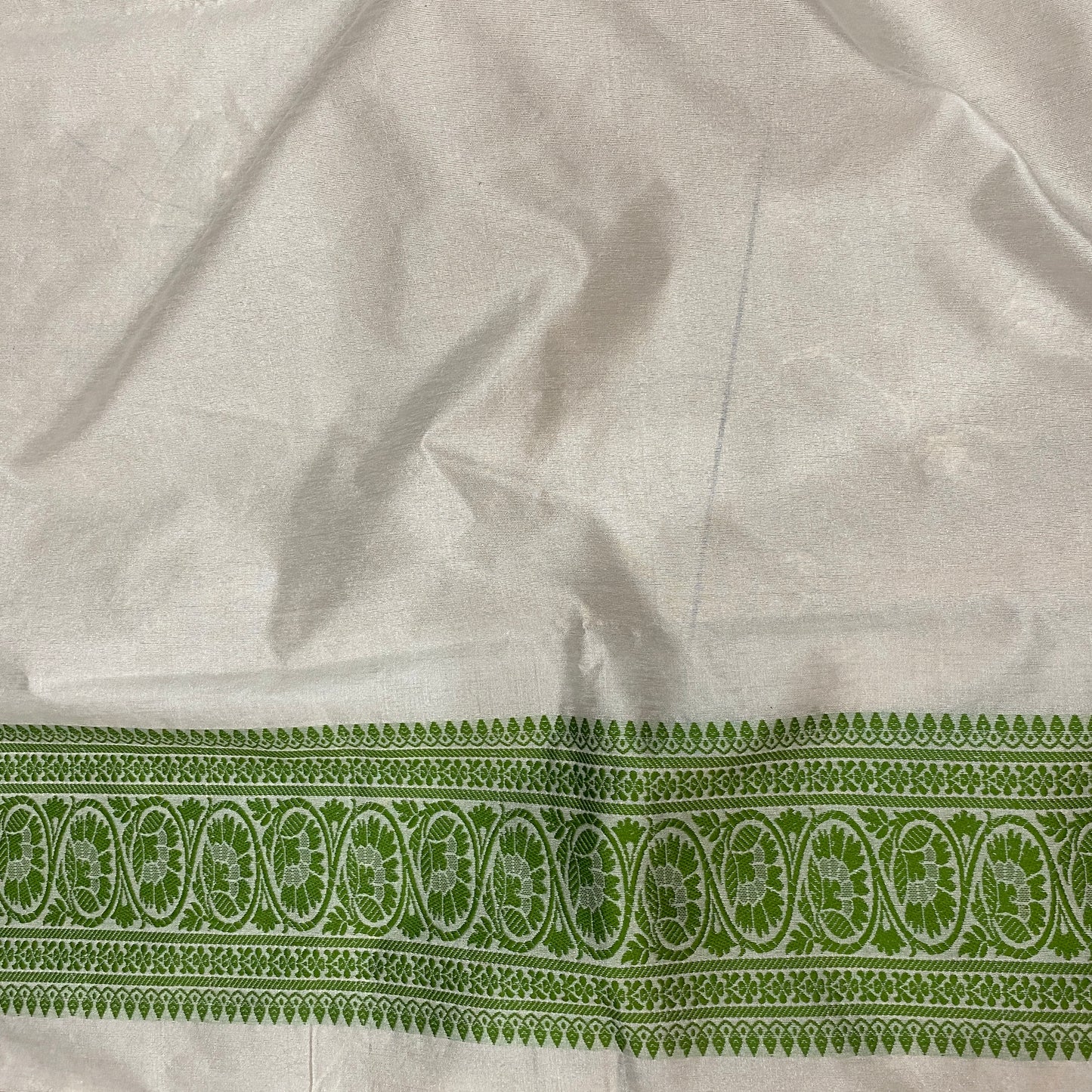 The Verdant Heirloom: Luxe Hand-Embroidered White & Green Pure Cotton Banarasi Sari by Shades Of Banaras - banarasi - banarasi saree shop - banarasi saree manufacturers - banarasi saree wholesale - banaraasi sarees - banarasi sari - banarasi saris - silk saree - silk sari - wedding saree - wedding sari - designer sari - wedding collection - gifting