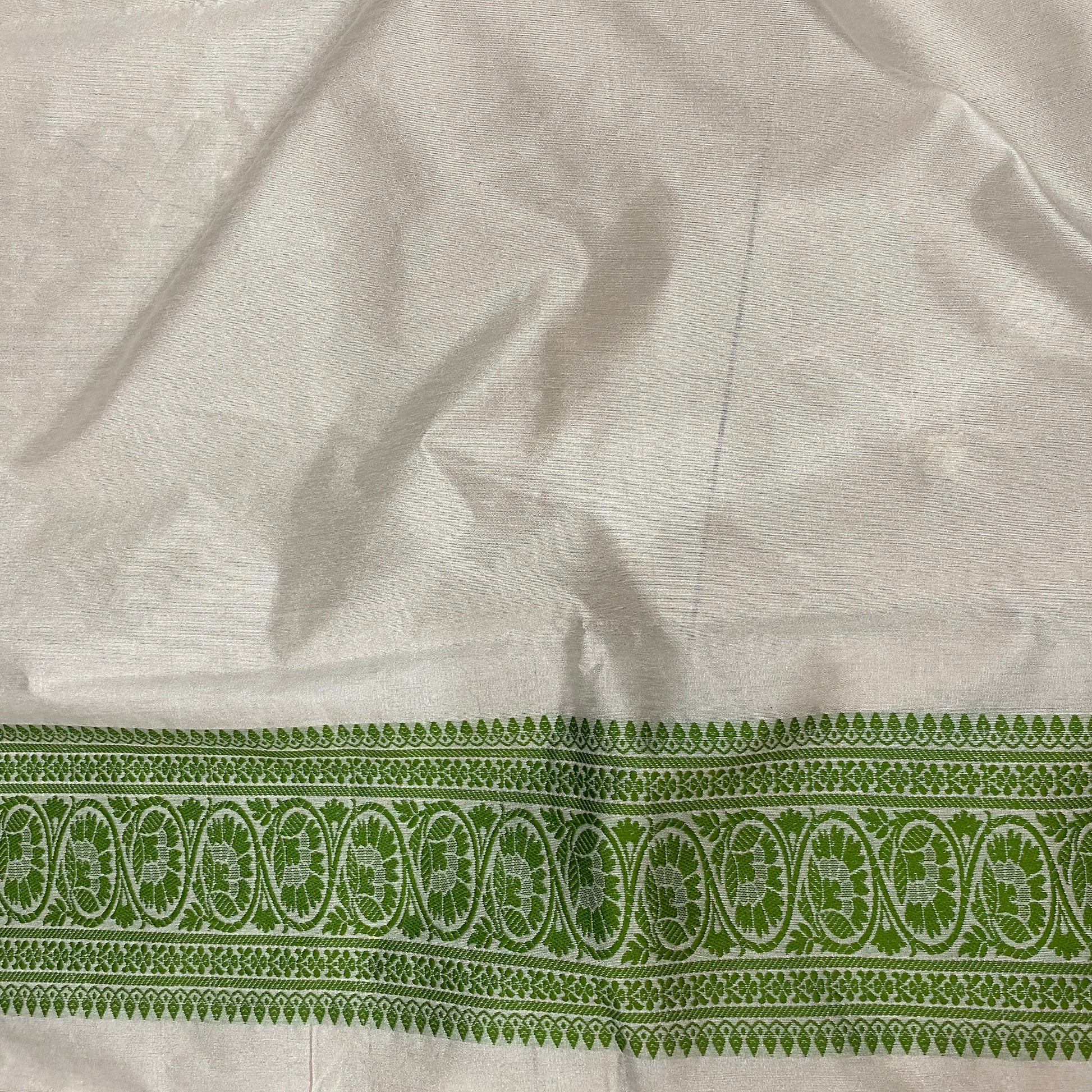 The Verdant Heirloom: Luxe Hand-Embroidered White & Green Pure Cotton Banarasi Sari by Shades Of Banaras - banarasi - banarasi saree shop - banarasi saree manufacturers - banarasi saree wholesale - banaraasi sarees - banarasi sari - banarasi saris - silk saree - silk sari - wedding saree - wedding sari - designer sari - wedding collection - gifting