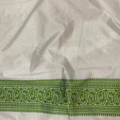 The Verdant Heirloom: Luxe Hand-Embroidered White & Green Pure Cotton Banarasi Sari by Shades Of Banaras - banarasi - banarasi saree shop - banarasi saree manufacturers - banarasi saree wholesale - banaraasi sarees - banarasi sari - banarasi saris - silk saree - silk sari - wedding saree - wedding sari - designer sari - wedding collection - gifting