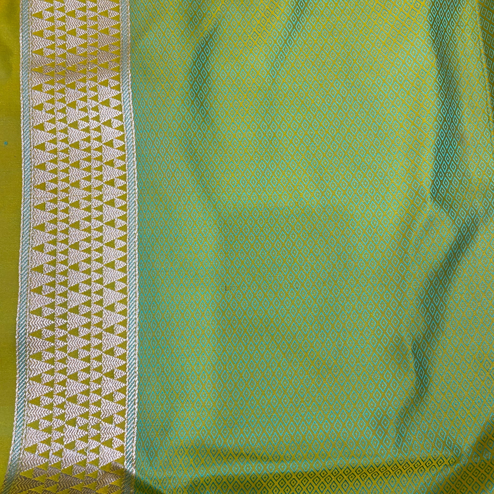 The Verdant Luxe: Emerald Striped Pure Satin Silk Banarasi Saree by Shades Of Banaras - banarasi - banarasi saree shop - banarasi saree manufacturers - banarasi saree wholesale - banaraasi sarees - banarasi sari - banarasi saris - silk saree - silk sari - wedding saree - wedding sari - designer sari - wedding collection - gifting
