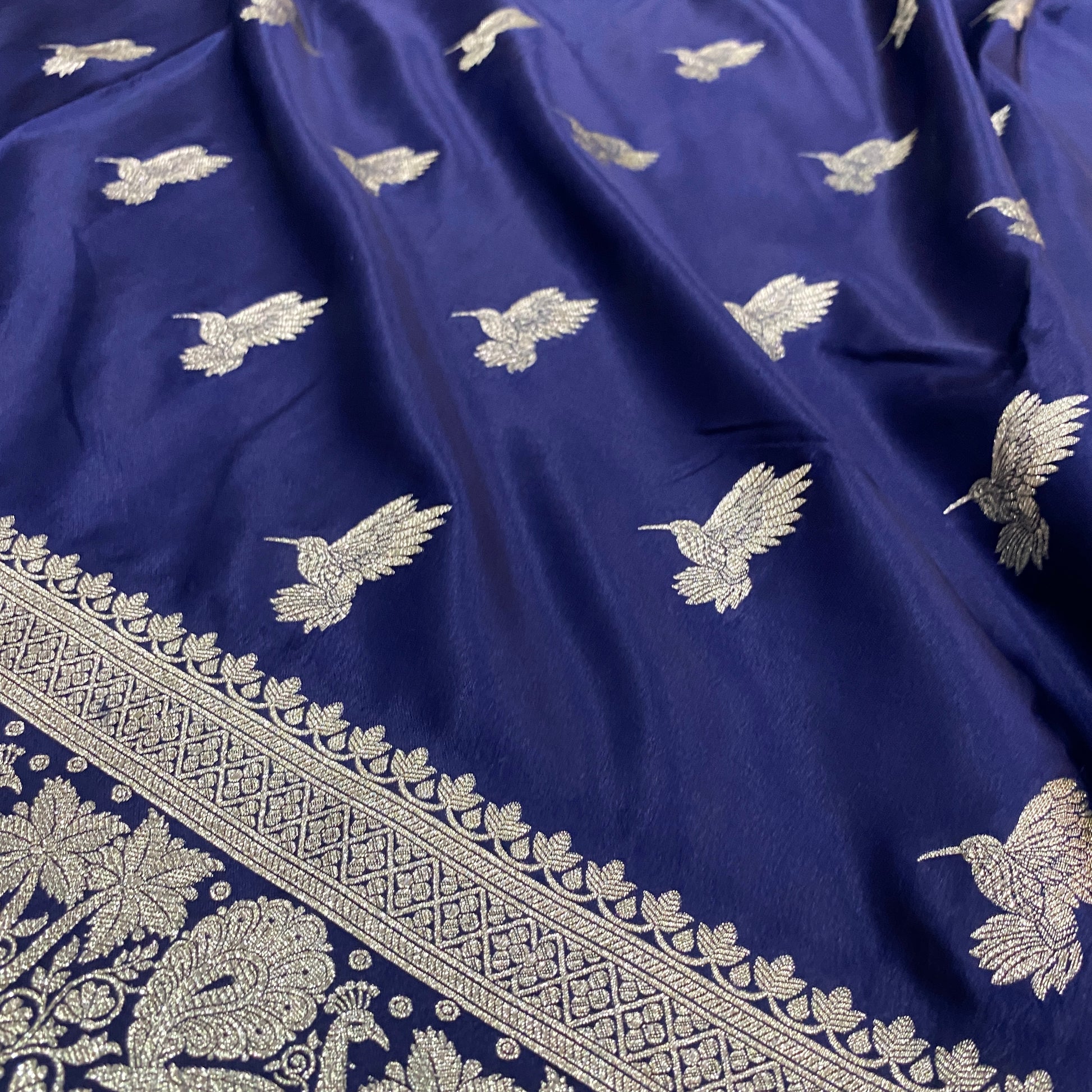 The Midnight Luxe Muse: Navy Blue Pure Satin Silk Bird Motif Banarasi Saree by Shades Of Banaras - banarasi - banarasi saree shop - banarasi saree manufacturers - banarasi saree wholesale - banaraasi sarees - banarasi sari - banarasi saris - silk saree - silk sari - wedding saree - wedding sari - designer sari - wedding collection - gifting