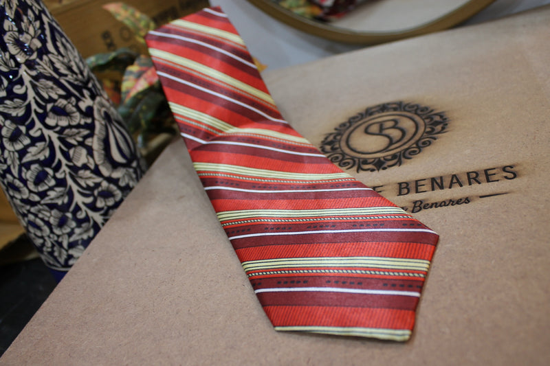Banarasi satin silk neck tie with bold red and maroon stripes by Shades of Benares.