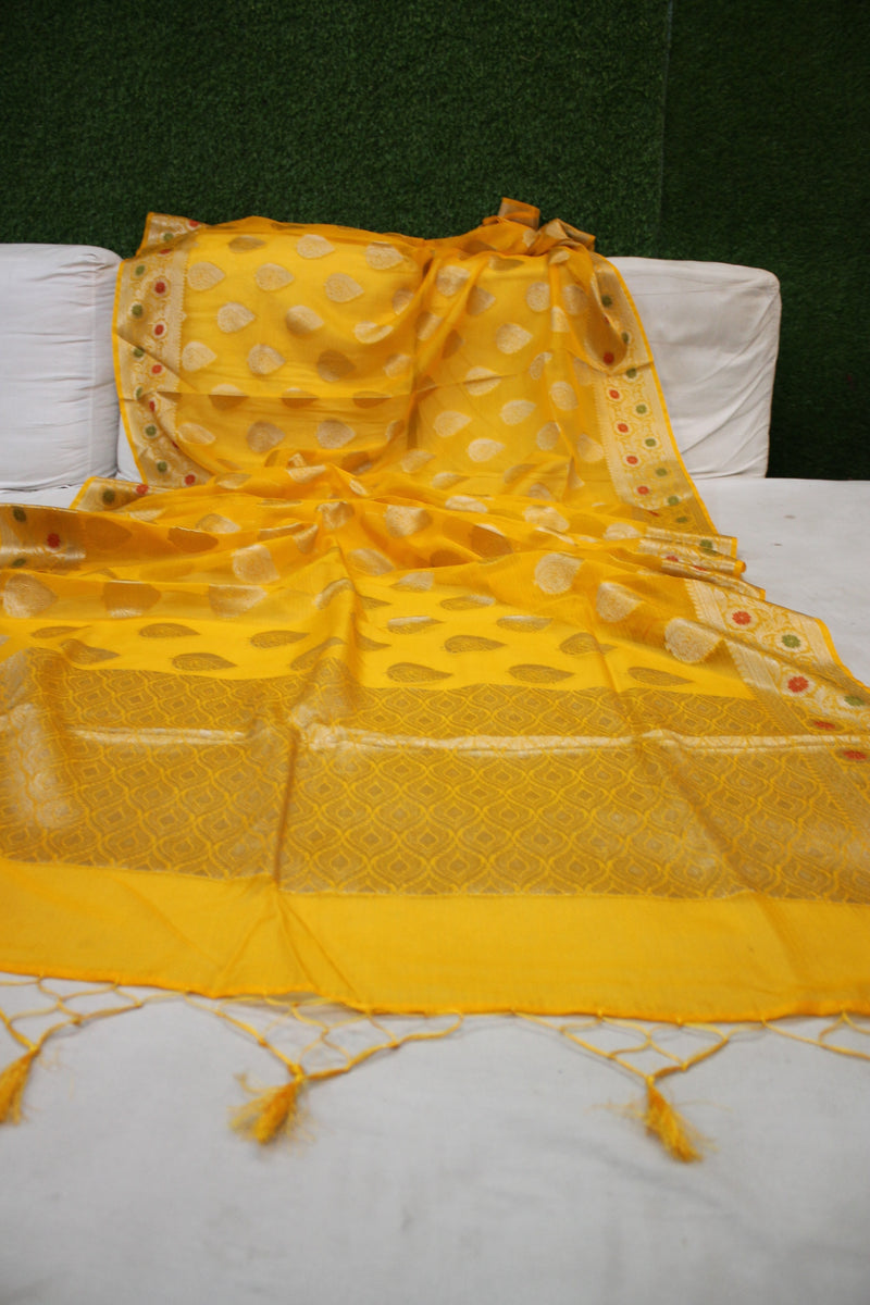 Vibrant yellow Kora Organza Handloom Banarasi Saree from Shades of Benares.