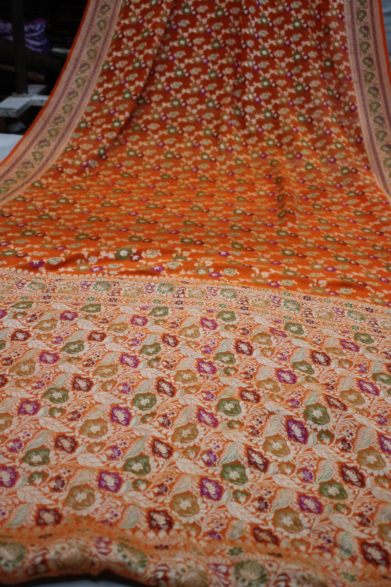 Stay stylish in the Summer Splendor Orange Pure Khaddi Georgette Banarasi Saree by Shades of Benares.
