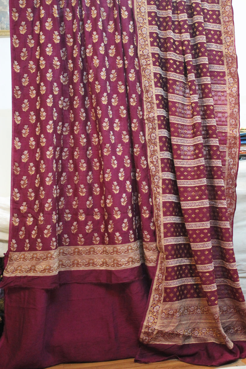 Upgrade your fashion game with a 3-piece Wine Banarasi Dress Material Set by Shades of Benares.