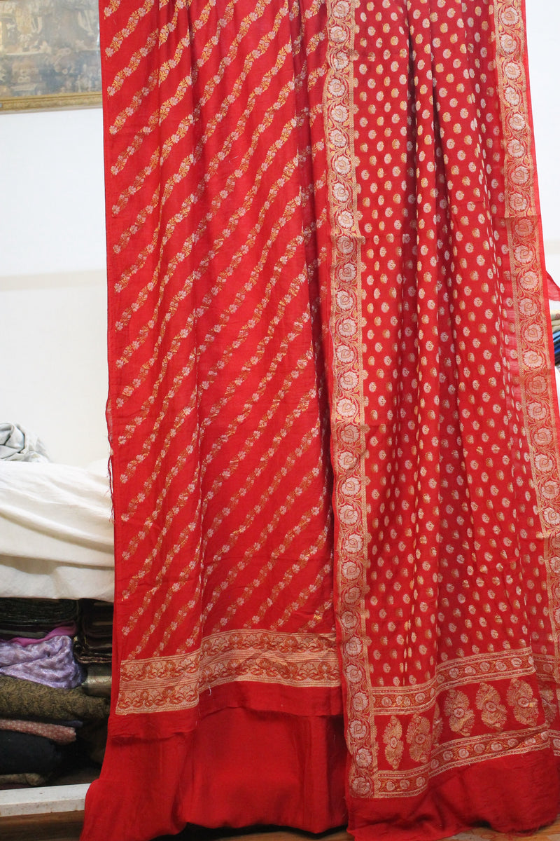 Red cotton silk Banarasi suit set by Shades of Benares, featuring regal charm in grey accents.