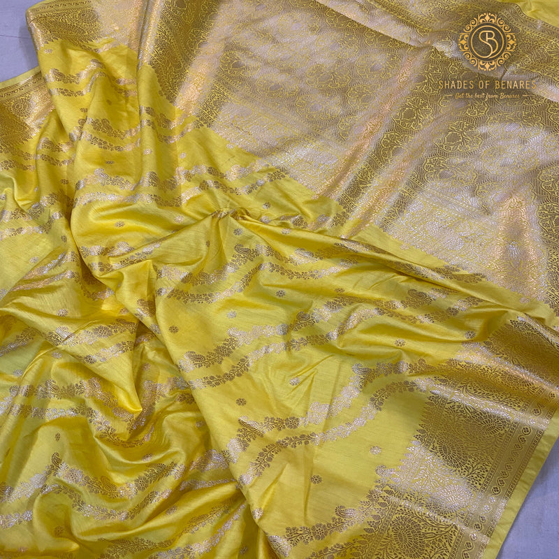 Luxurious bright yellow Crepe Silk Handloom Saree showcasing elegant silk craftsmanship.