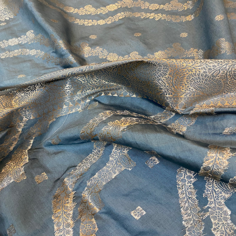 A beautiful metallic grey Banarasi saree made of handloom crepe silk fabric.