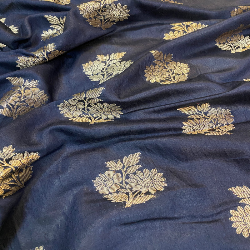 Shop our exquisite navy blue crepe silk handloom Banarasi saree for a stylish look at parties and special occasions. Embrace timeless elegance!