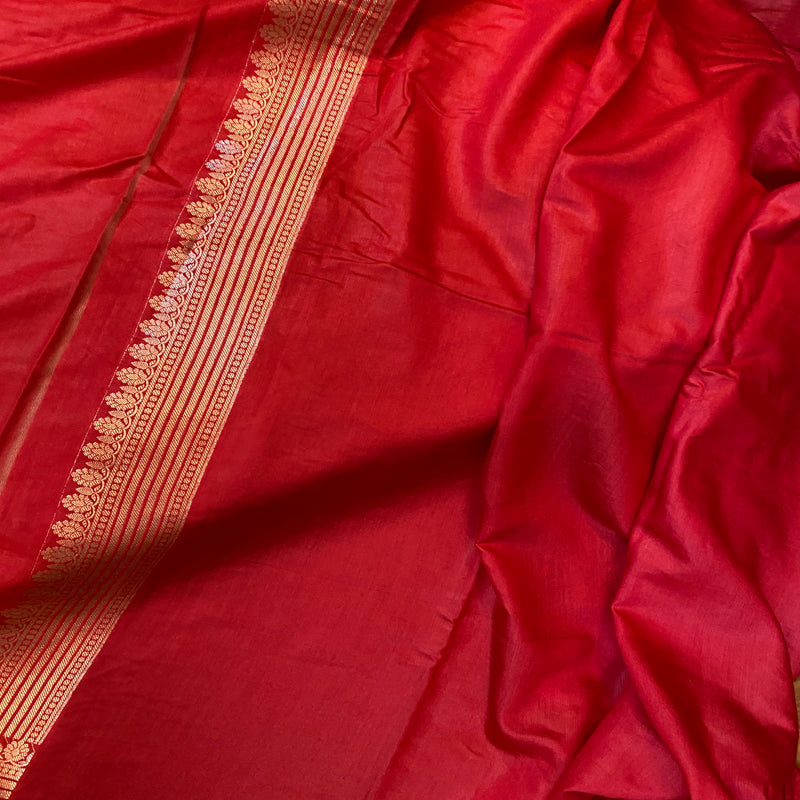 Red silk Banarasi saree with radiant finish.
