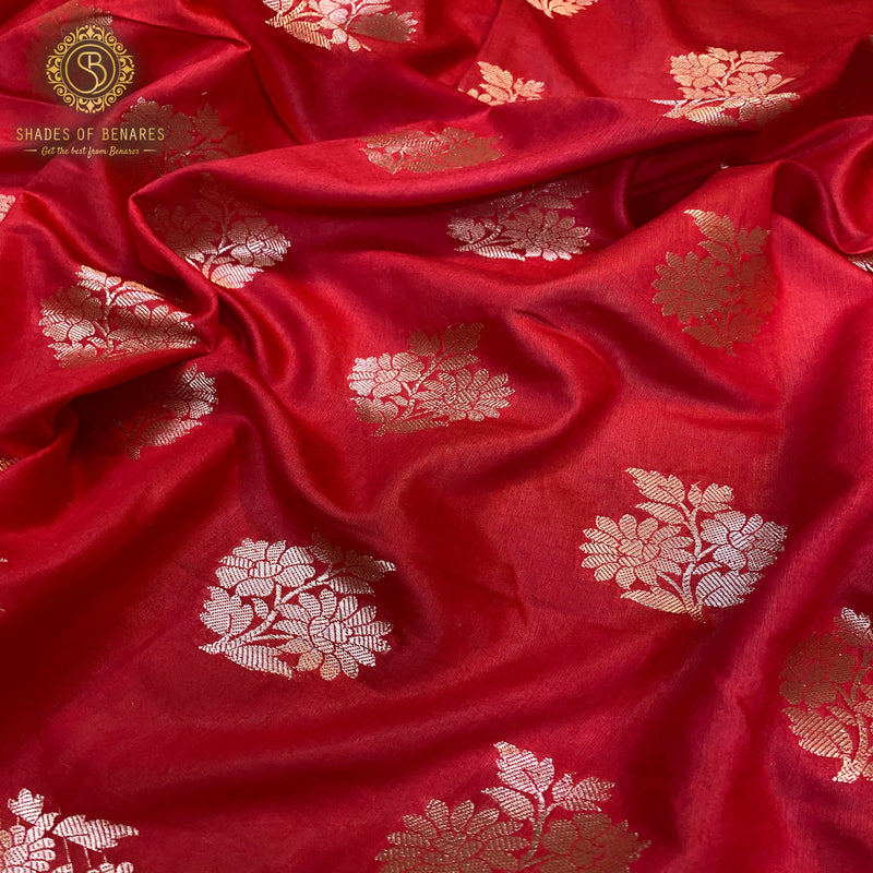 Red silk handloom Banarasi saree with radiant sheen.