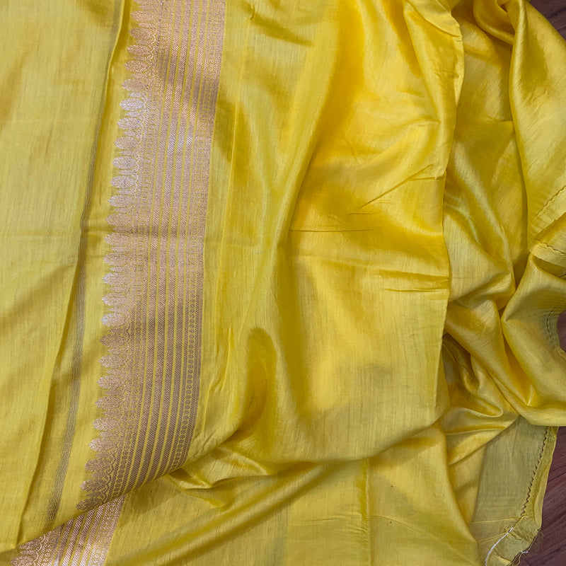 Vibrant yellow Banarasi silk saree, perfect for celebrations and special occasions. Illuminate your festive look with traditional elegance. Shop now!