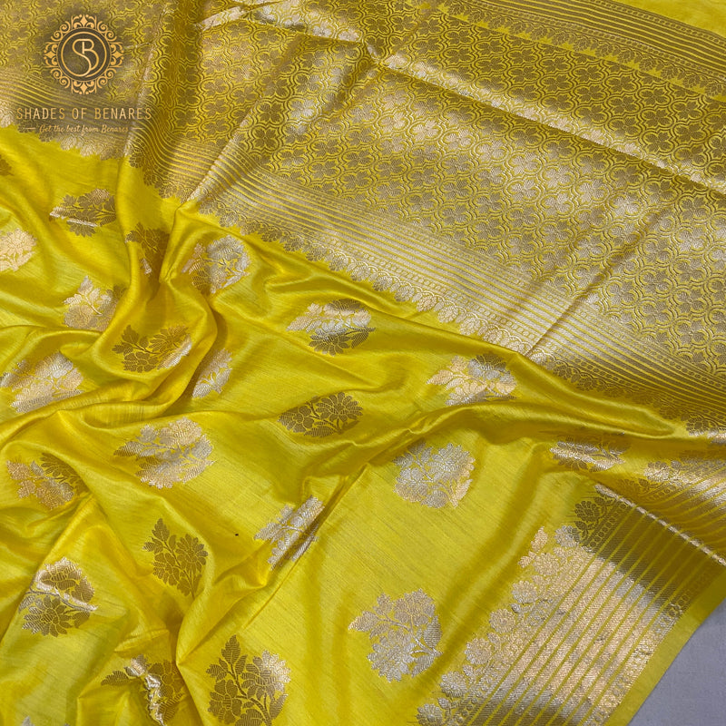 Vibrant yellow handloom Banarasi silk saree, perfect for celebrations. Traditional elegance and festive radiance.