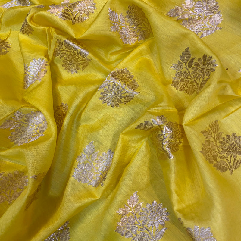 Add a pop of color to your festive look with our yellow handloom Banarasi silk saree. Shop now!