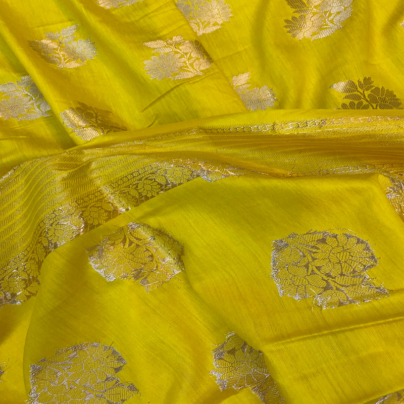 Embrace festive radiance with our vibrant yellow handloom Banarasi silk saree. Perfect for celebrations and special occasions. Shop now!